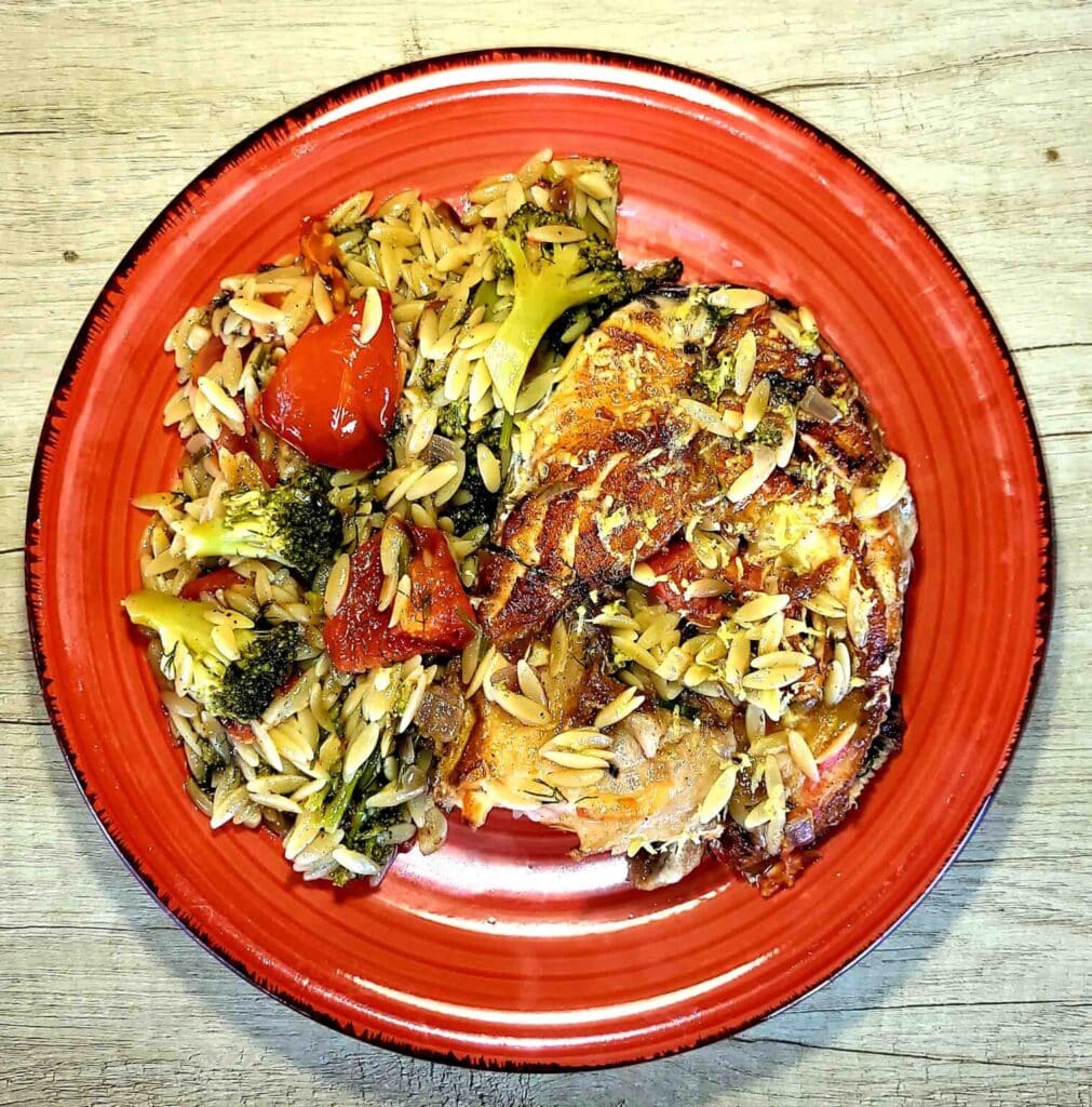 Salmon with pasta and broccoli or cauliflower - Photo By Thanasis Bounas